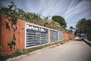 to help promote end-life-life literacy giant walls with chalk and the phrase 'before i die' stand in the street for people to answer.